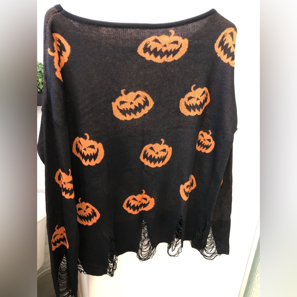 Jack “O “ Lantern distressed off the shoulder sweater